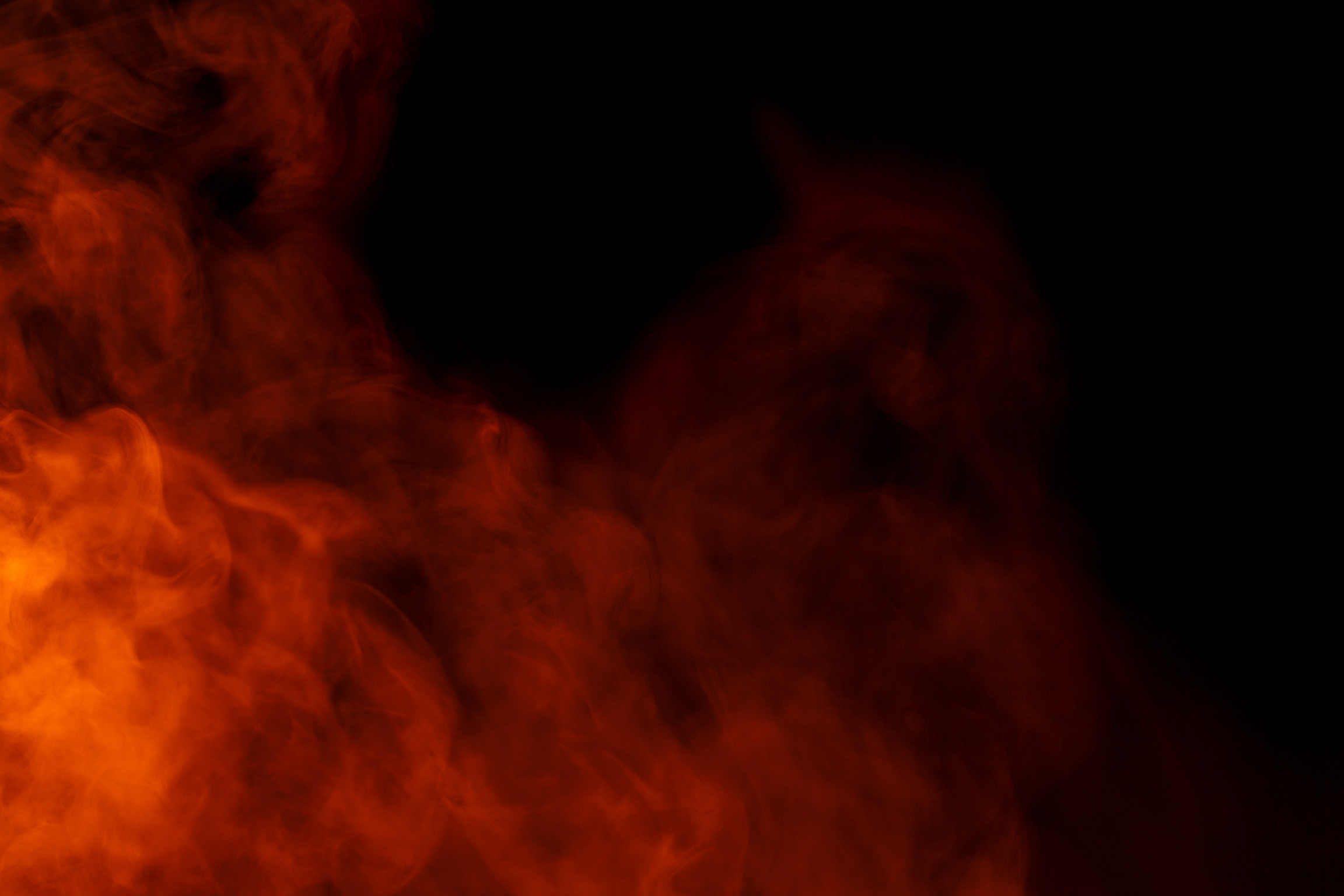 Abstract Orange Smoke Hookah on a Black Background.